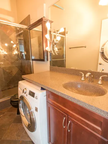 a view of a patio with table and chairs potted plants