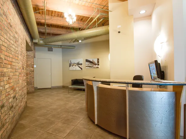 a view of a closet area with wooden floor
