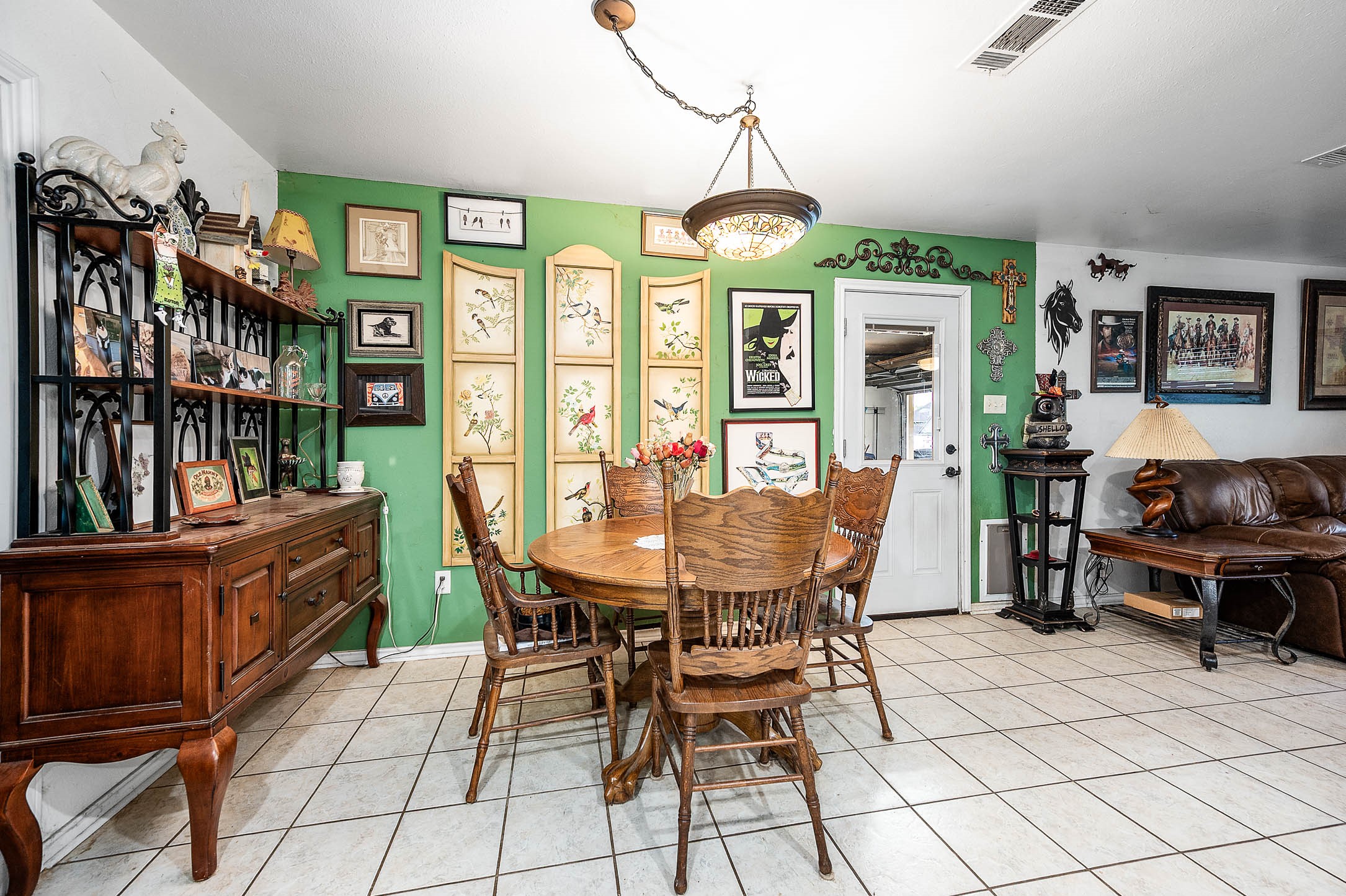 100 Magnolia Place Coldspring, TX 77331 - Photo 14 of 50 a view of a dining room with furniture a rug and wooden floor