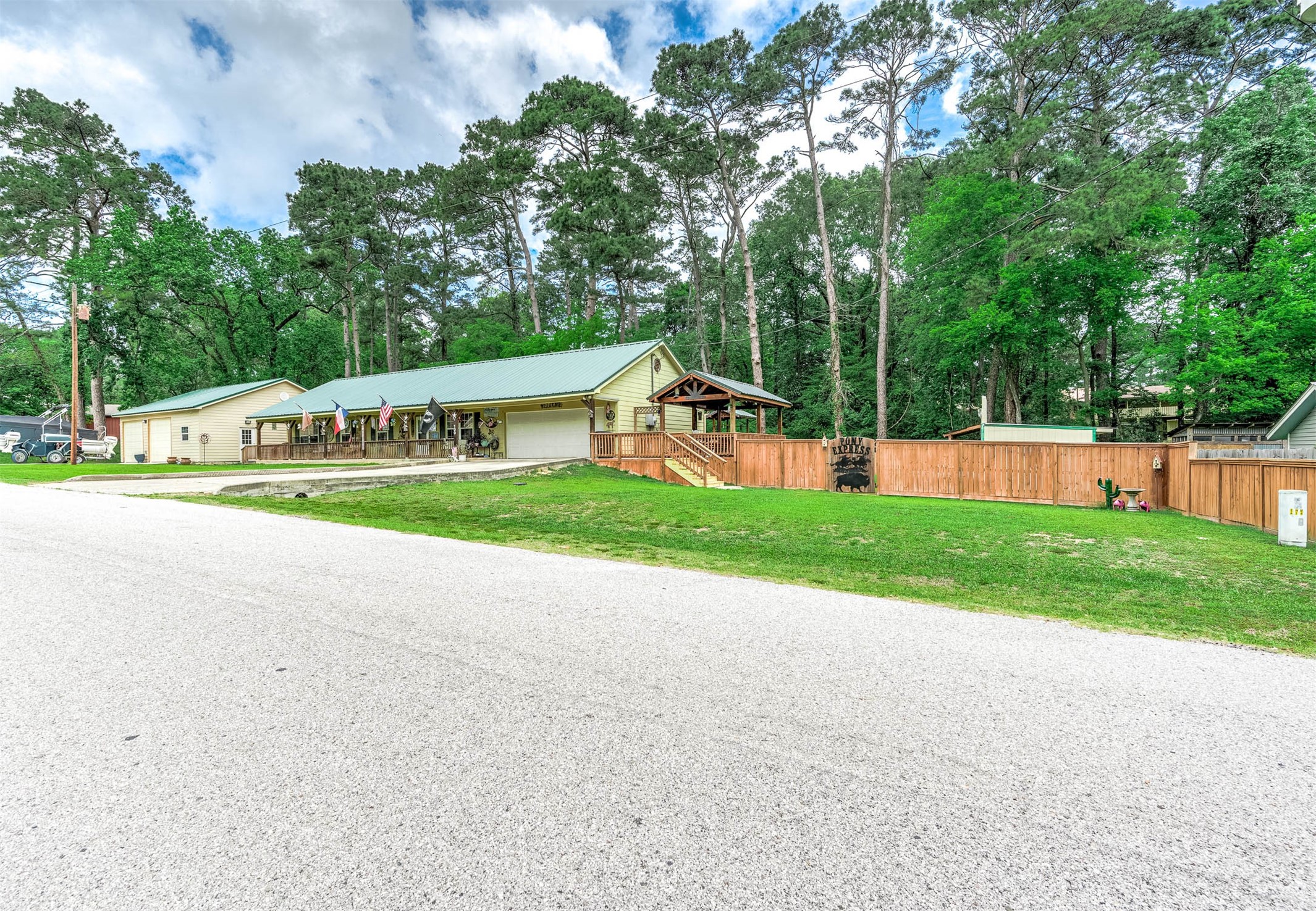 100 Magnolia Place Coldspring, TX 77331 - Photo 2 of 50 a view of a park with large trees