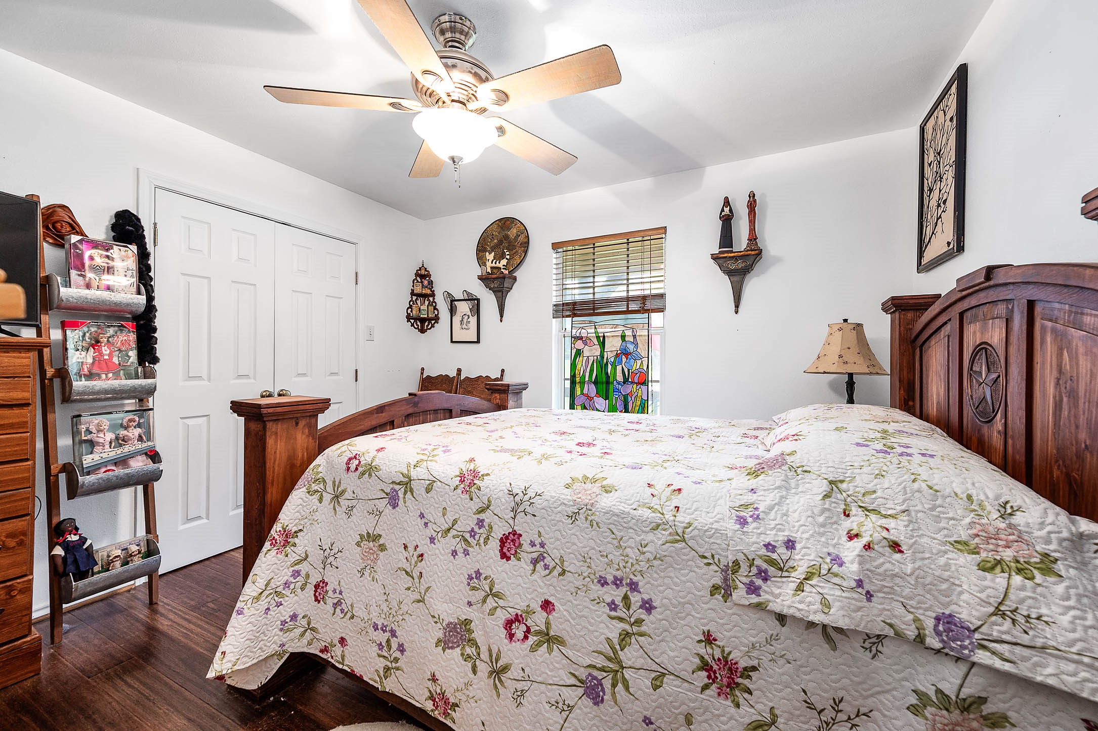 100 Magnolia Place Coldspring, TX 77331 - Photo 21 of 50 a bedroom with bed and wooden floor