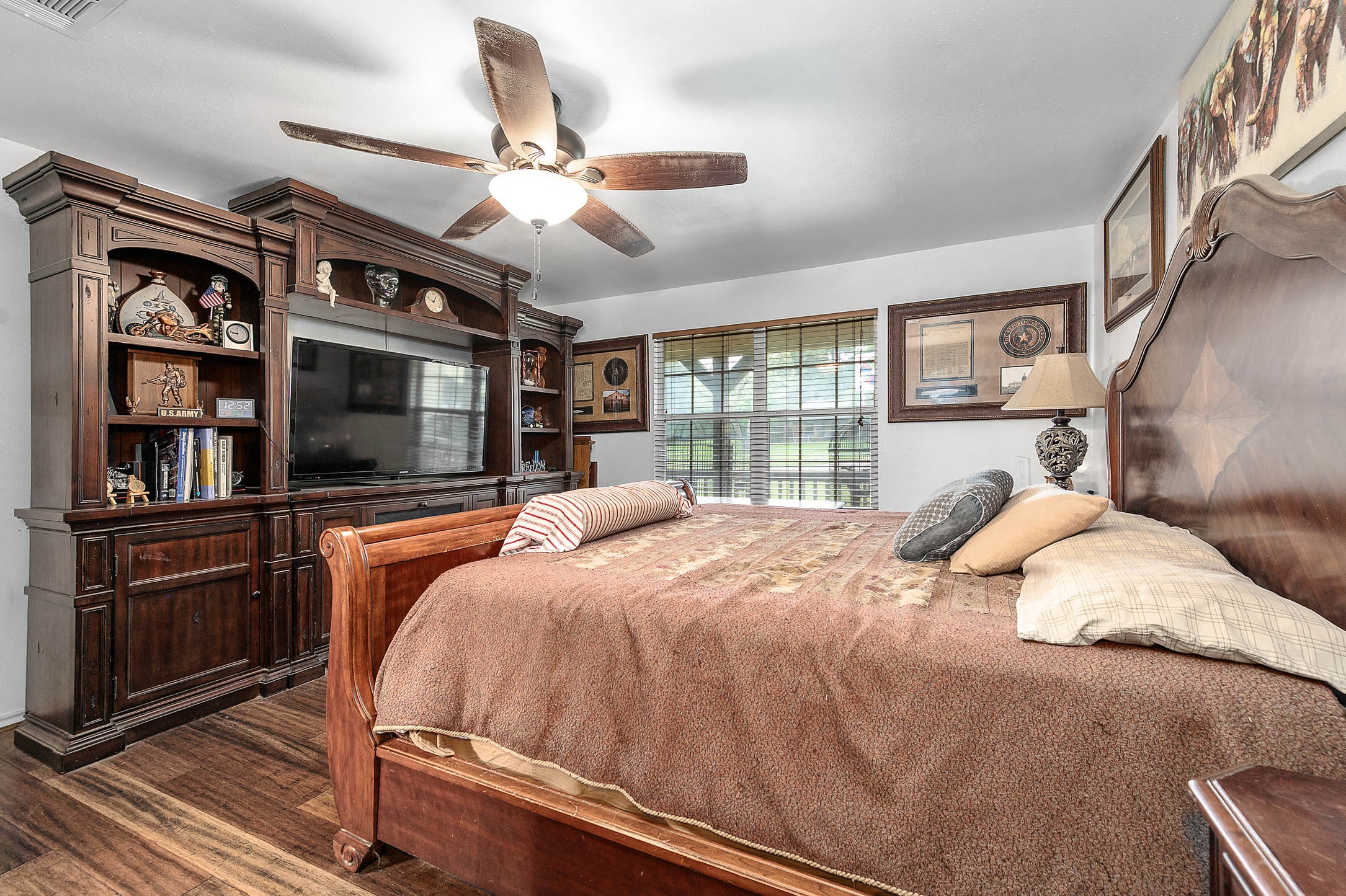 100 Magnolia Place Coldspring, TX 77331 - Photo 24 of 50 a bedroom with a large bed and a window