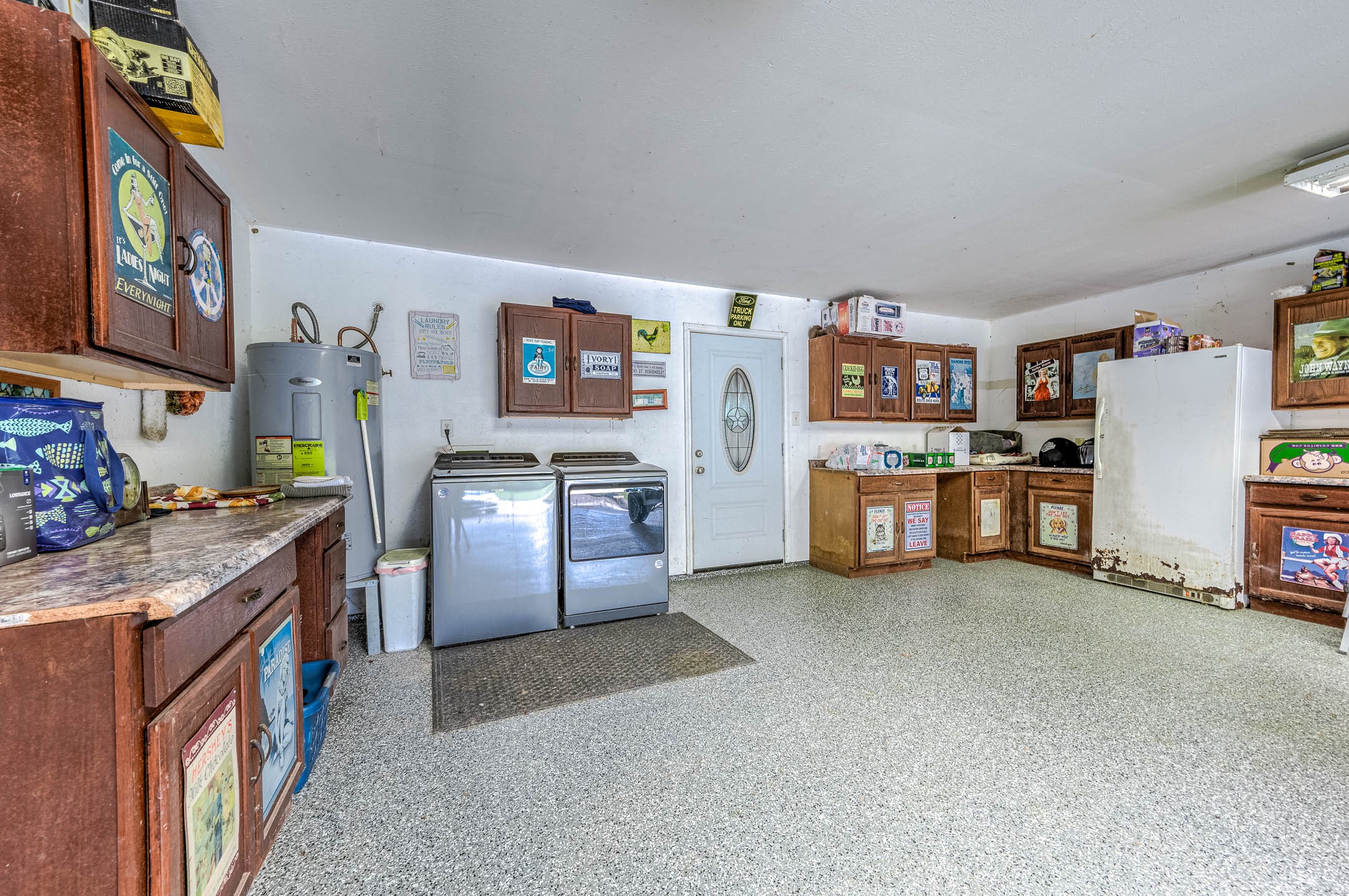 100 Magnolia Place Coldspring, TX 77331 - Photo 29 of 50 a kitchen with stainless steel appliances granite countertop a refrigerator and stove