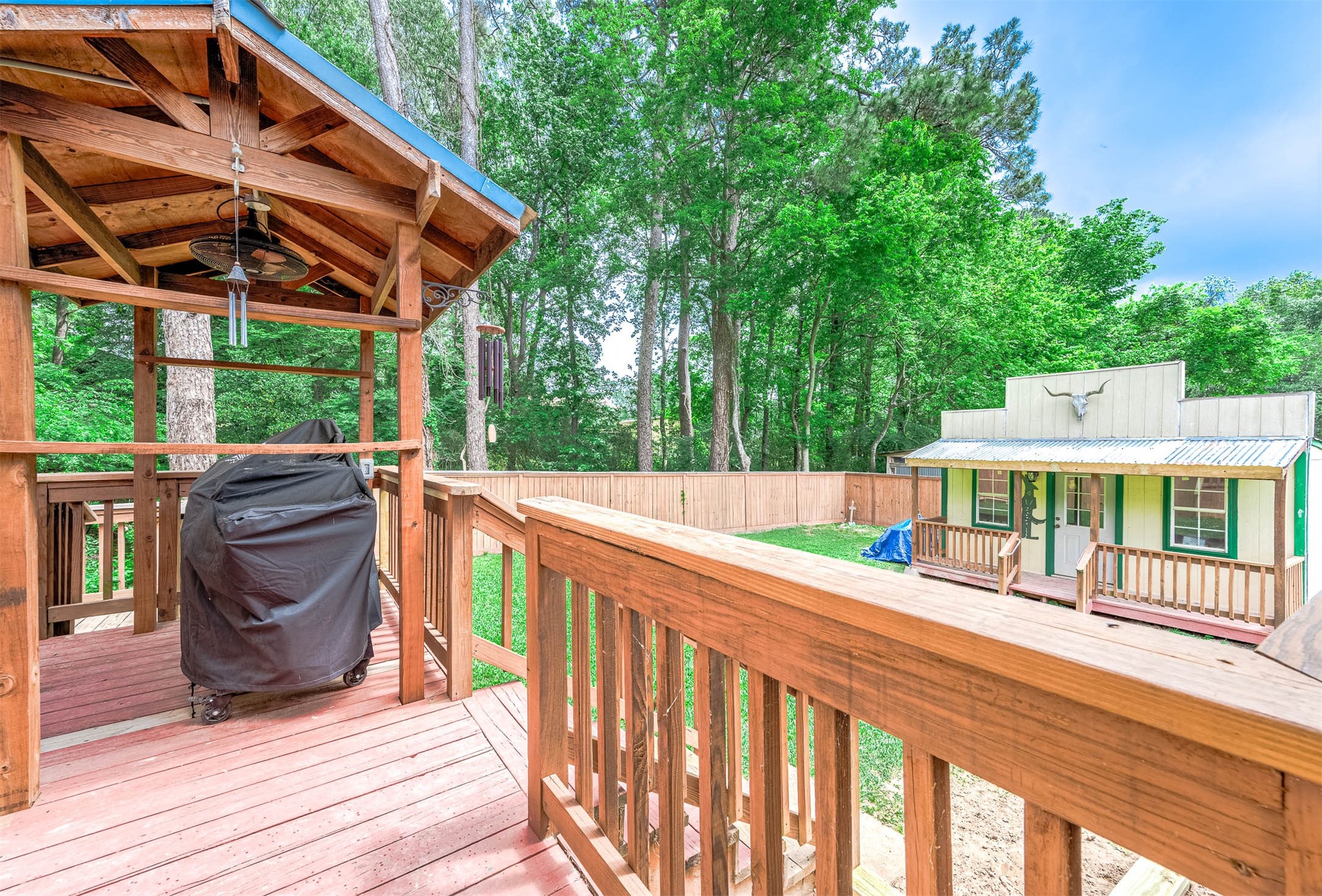 100 Magnolia Place Coldspring, TX 77331 - Photo 34 of 50 a view of a roof deck with wooden fence