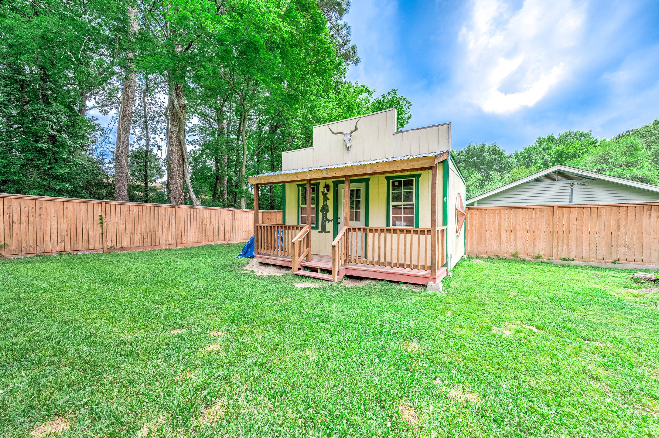 100 Magnolia Place Coldspring, TX 77331 - Photo 38 of 50 a view of a house with a yard and deck