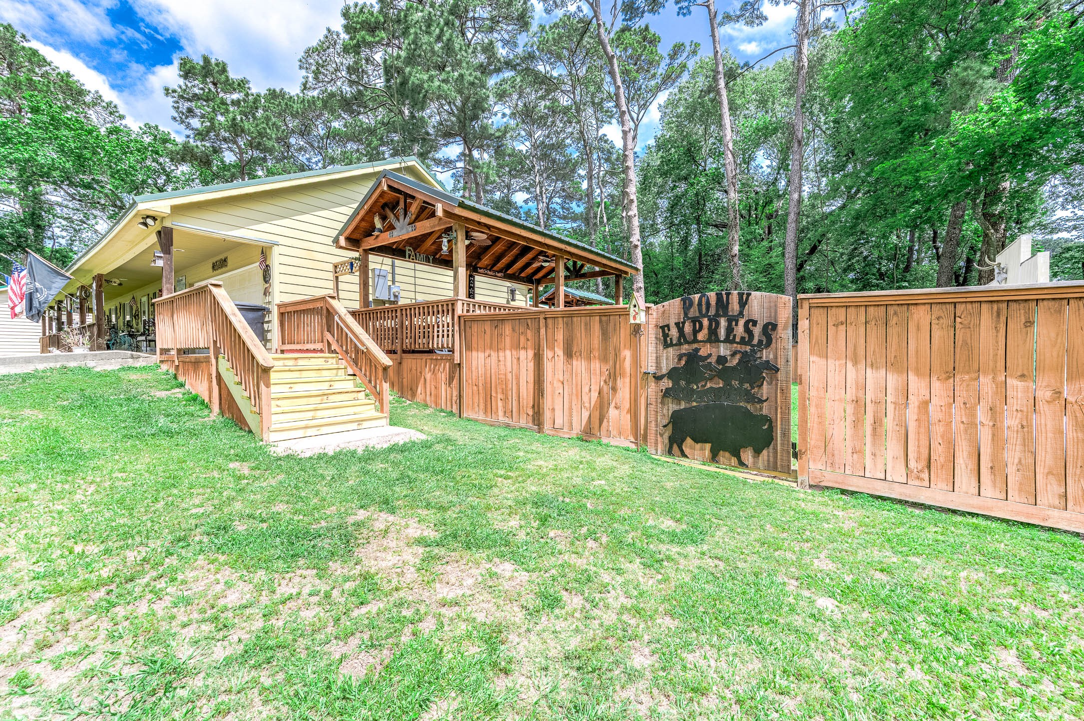 100 Magnolia Place Coldspring, TX 77331 - Photo 4 of 50 a house with trees in the background