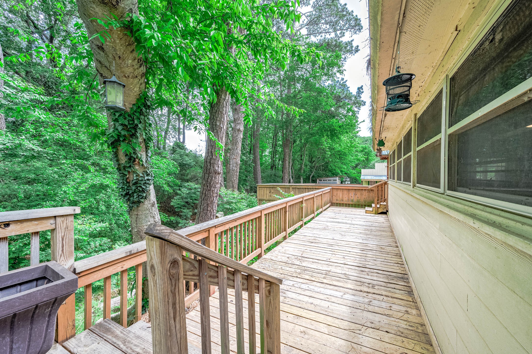 100 Magnolia Place Coldspring, TX 77331 - Photo 44 of 50 a view of balcony with wooden floor and fence