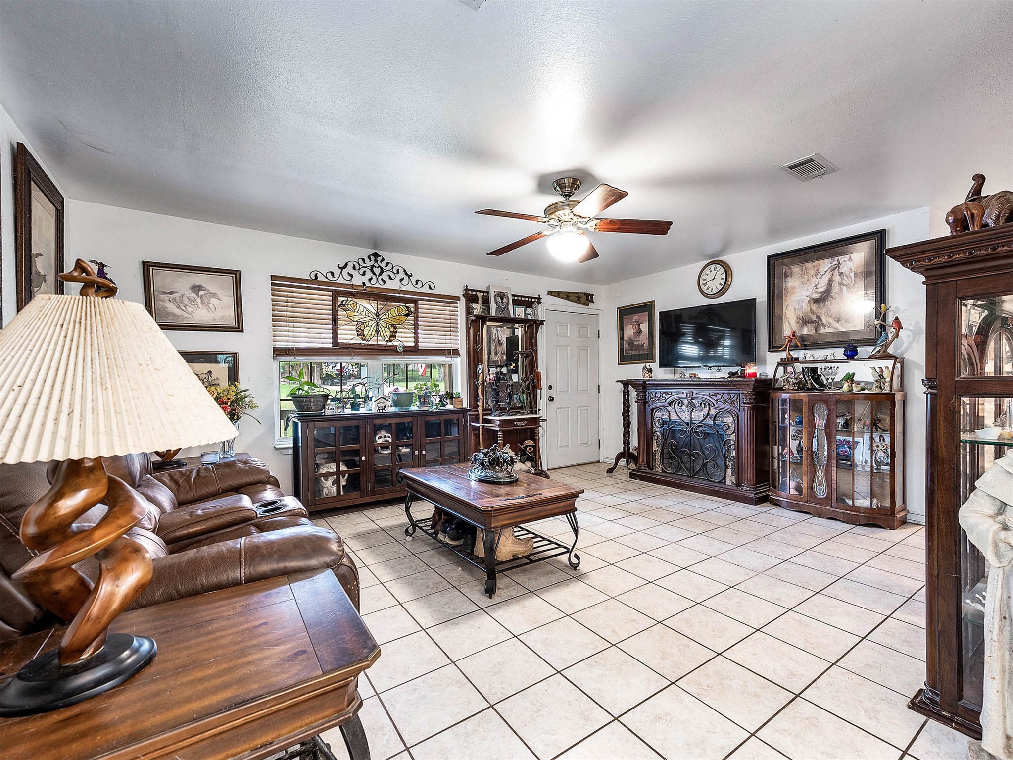 100 Magnolia Place Coldspring, TX 77331 - Photo 9 of 50 a living room with furniture and a flat screen tv