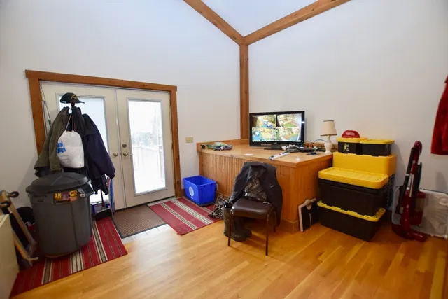 a room with furniture and wooden floor