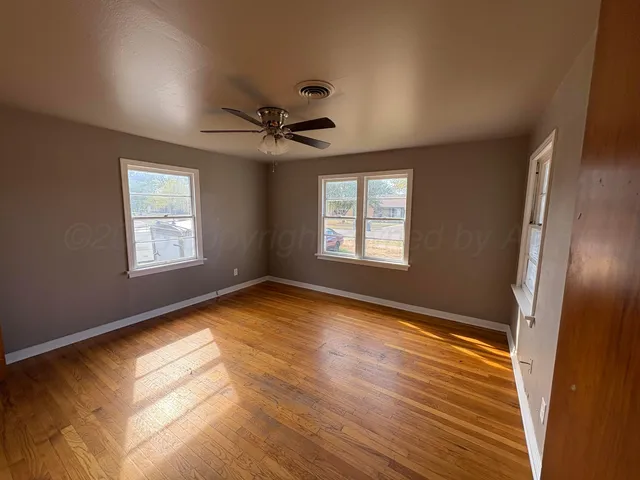 a view of an empty room and window