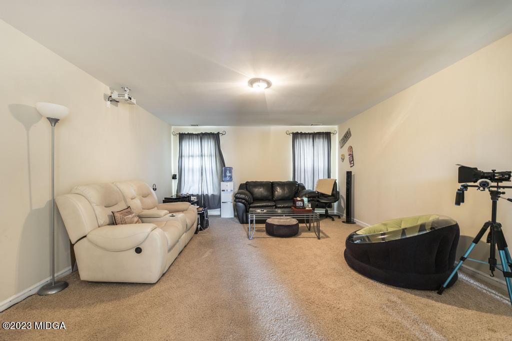 901 Broderick Circle Warner Robins, GA 31088 - Photo 11 of 19 a living room with furniture and a wooden floor
