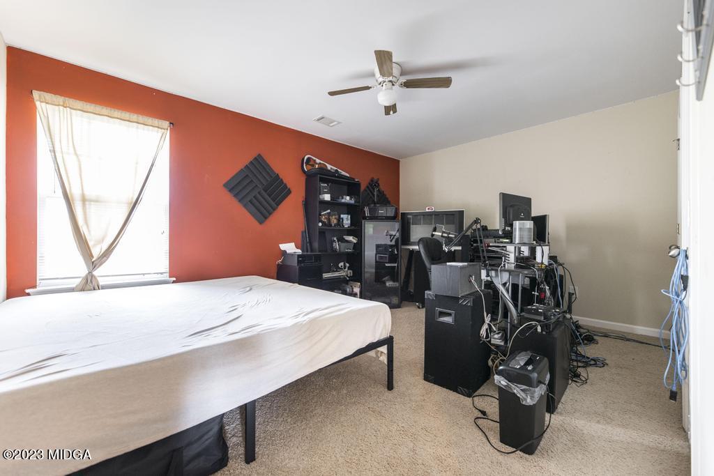 901 Broderick Circle Warner Robins, GA 31088 - Photo 16 of 19 a bed room with a bed and a large window