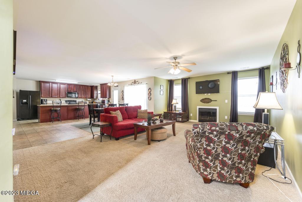 901 Broderick Circle Warner Robins, GA 31088 - Photo 3 of 19 a living room with furniture and a fireplace