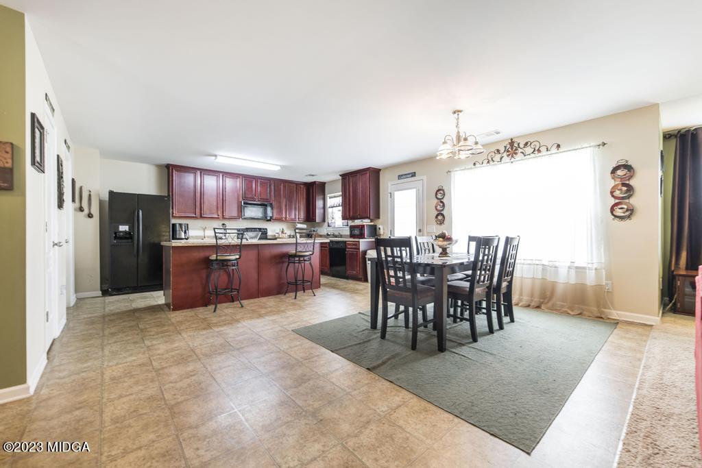 901 Broderick Circle Warner Robins, GA 31088 - Photo 4 of 19 a view of a dining room kitchen and a window