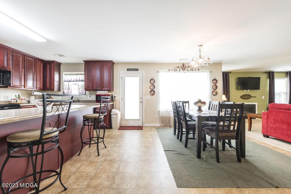 901 Broderick Circle Warner Robins, GA 31088 - Photo 5 of 19 a view of a dining room with furniture