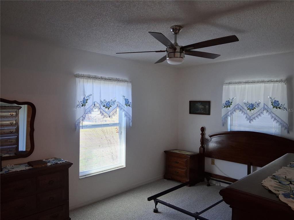 515 Boitnott Lane Bushnell, FL 33513 - Photo 12 of 13 a living room with furniture and a window