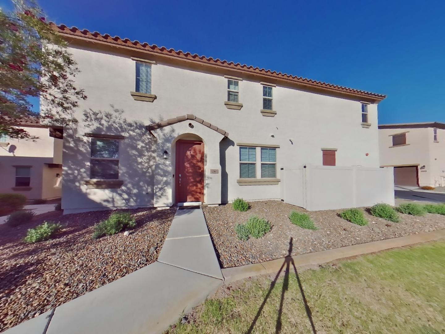 12565 West Via Dona Road Peoria, AZ 85383 - Photo 1 of 17 a front view of a house with garden