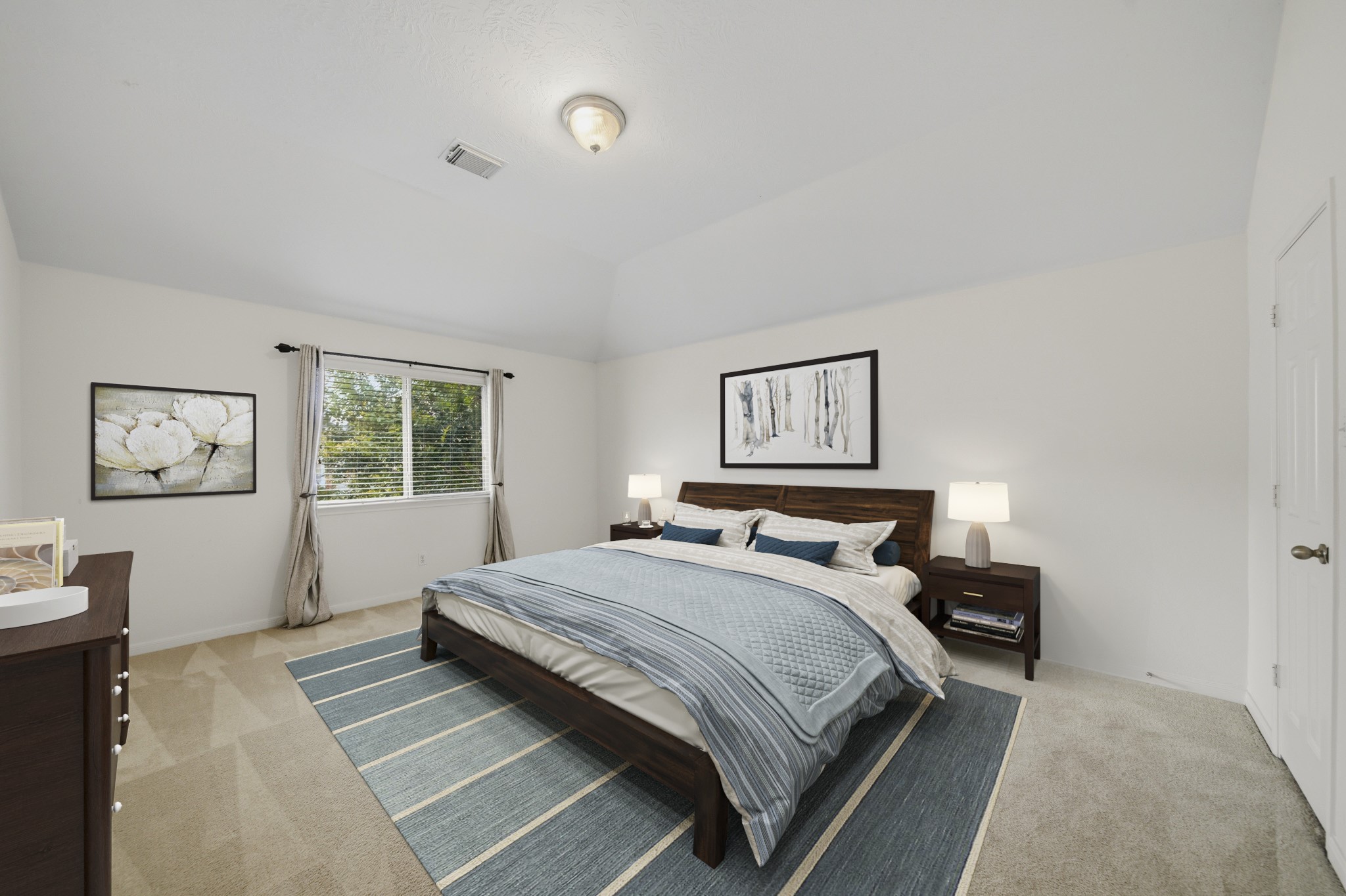 3306 Colleville Sur Mer Lane Spring, TX 77388 - Photo 17 of 30 Virtually Staged: This spacious bedroom offers a calm and inviting retreat with soft neutral tones, plush carpeting, and abundant natural light. A vaulted ceiling enhances the sense of openness, while the large window frames peaceful outdoor views and fills the room with sunlight.