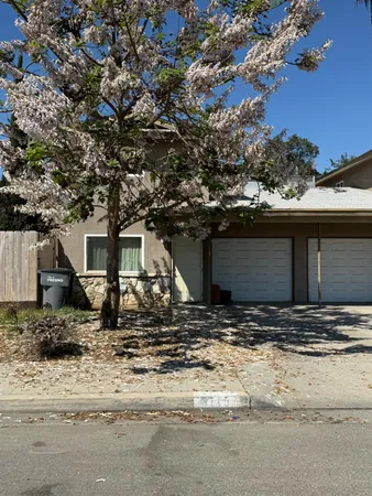 a view of a house with a tree tree