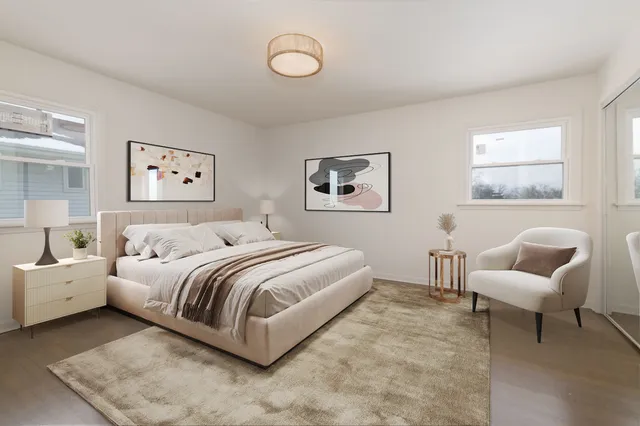 a bedroom with a bed and a couch