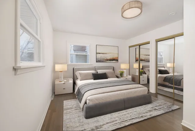 a bedroom with a large bed and a couch