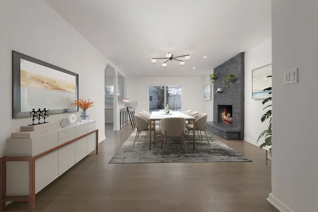 a dining room with furniture and view of kitchen