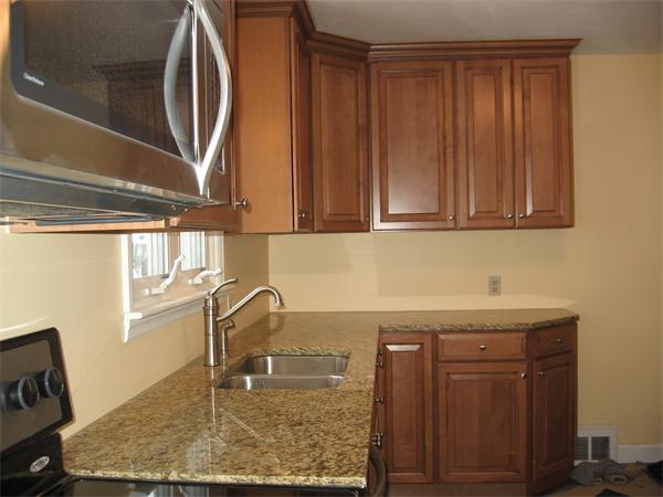 308 Dwight Road Springfield, MA 01108 - Photo 3 of 12 a bathroom with a sink a vanity and mirror