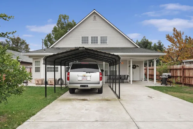 a view of house and outdoor space with yard