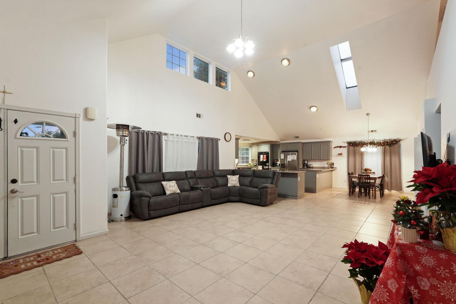 336 Locust Street Lodi, CA 95240 - Photo 16 of 31 a living room with furniture and a chandelier