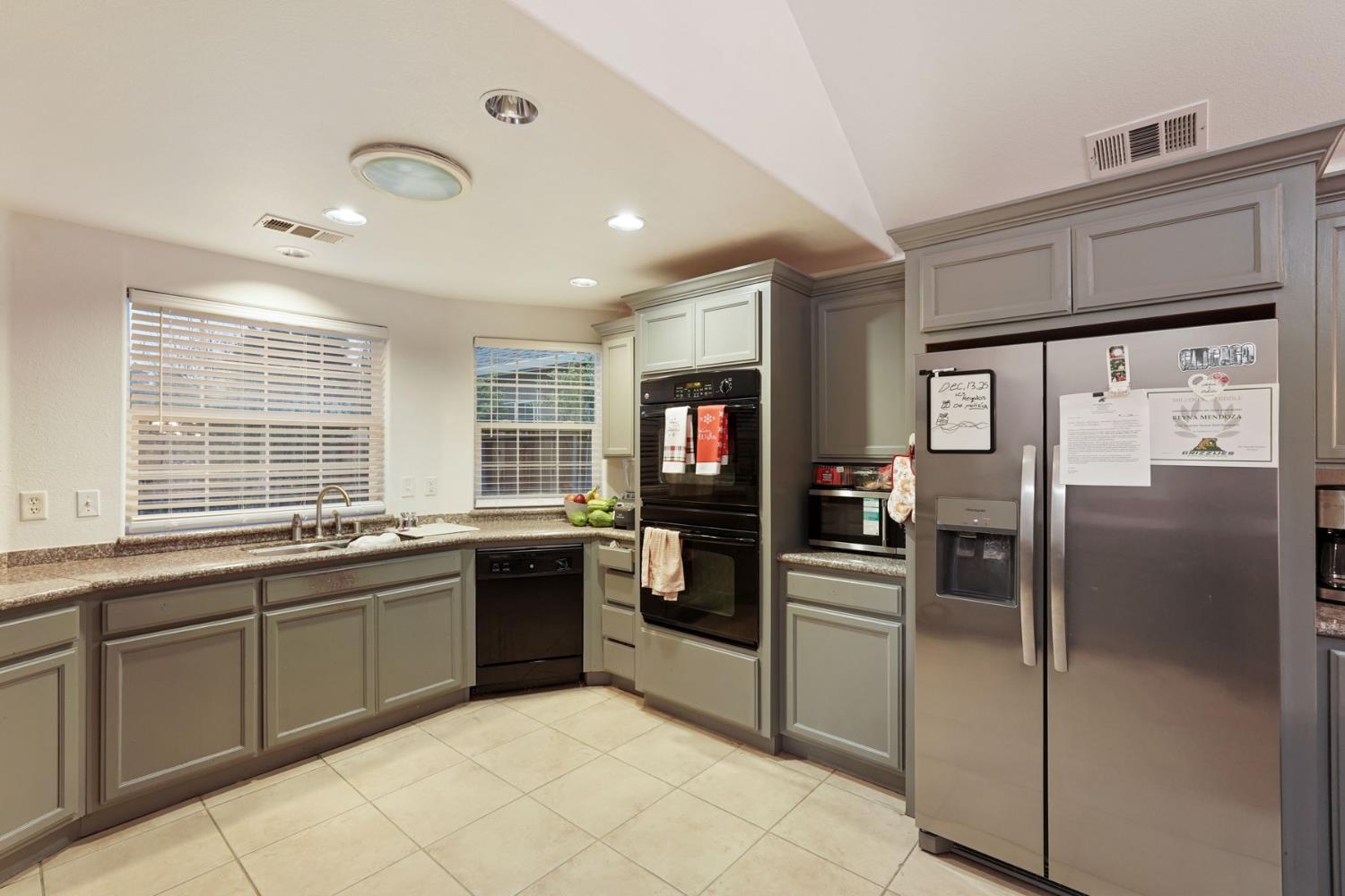 336 Locust Street Lodi, CA 95240 - Photo 19 of 31 a kitchen with stainless steel appliances granite countertop a refrigerator and a sink