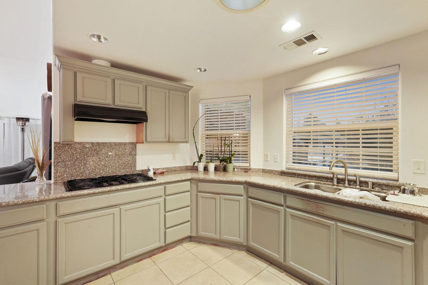 336 Locust Street Lodi, CA 95240 - Photo 20 of 31 a kitchen with a sink and cabinets