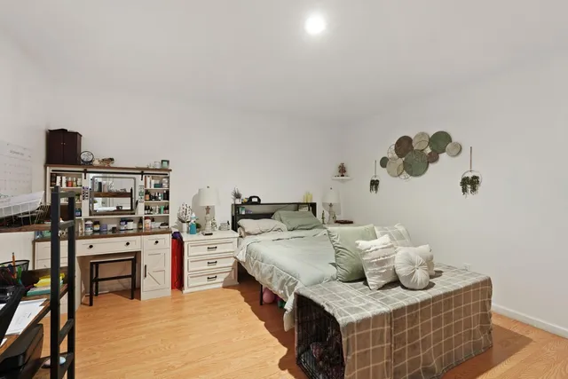 a living room with furniture and flat screen tv