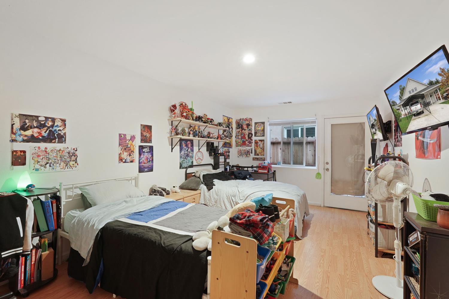 336 Locust Street Lodi, CA 95240 - Photo 24 of 31 a bed room with a bed and a book shelf