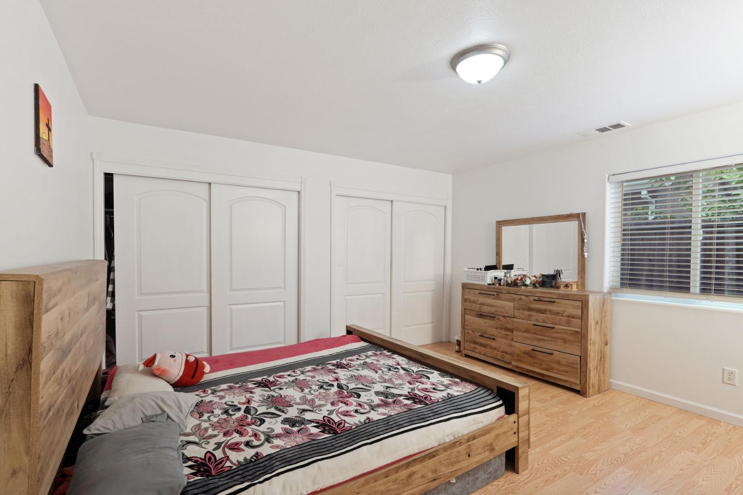 336 Locust Street Lodi, CA 95240 - Photo 8 of 31 a bed room with a bed and a window