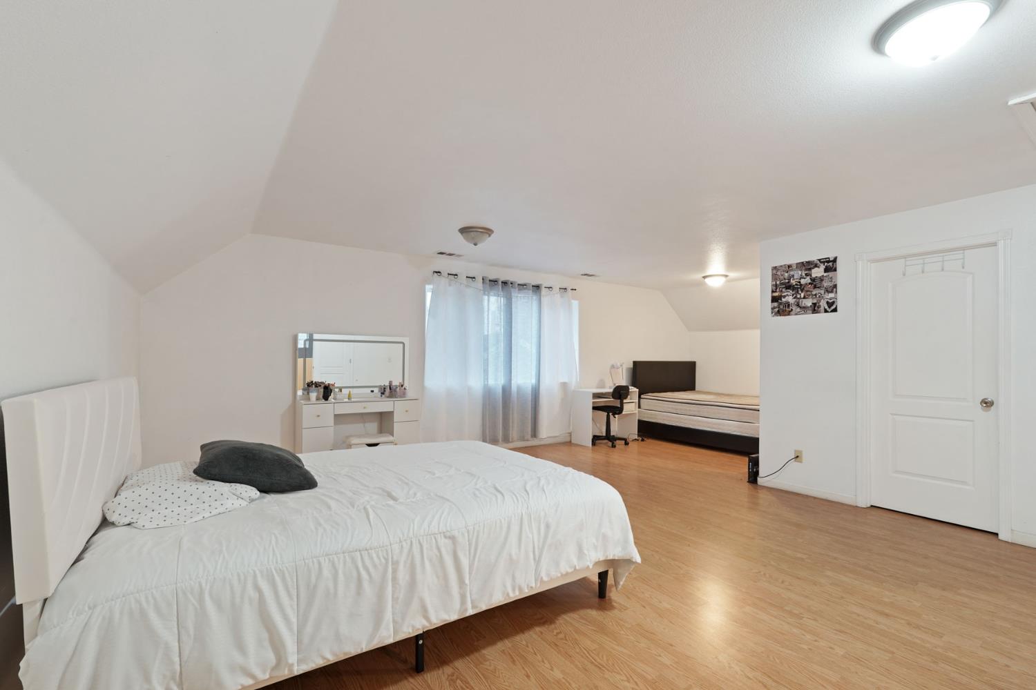 336 Locust Street Lodi, CA 95240 - Photo 10 of 31 a bedroom with a bed and window