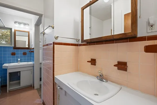 a bathroom with a sink and a mirror