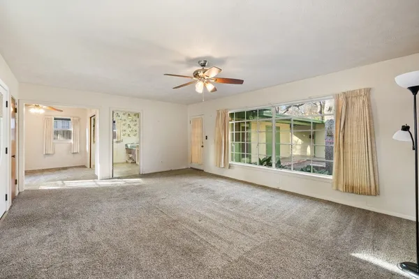 a view of an empty room with a window