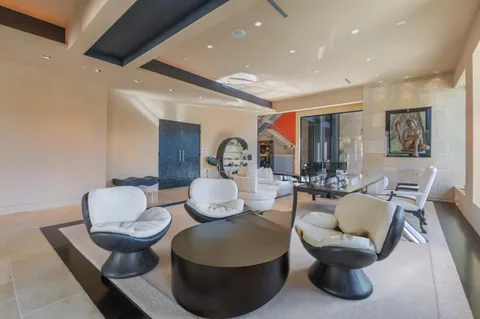 a living room with furniture and a potted plant