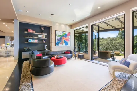 a view of a living room and dining room