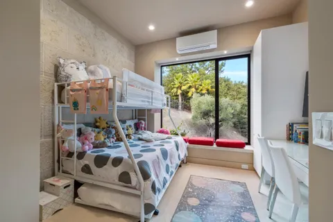 an aerial view of a house with a lake view