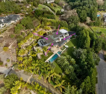 a view of a house with a street from a garden