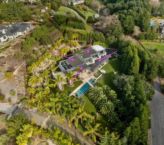 a view of a house with a street from a garden