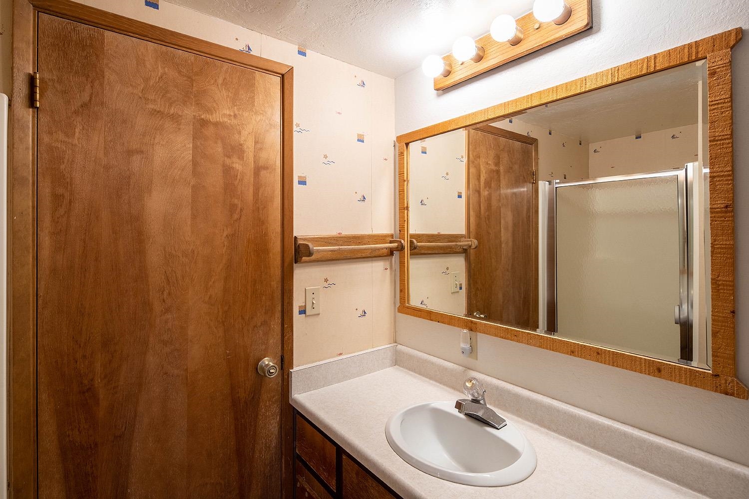 12119 Brookstone Drive Truckee, CA 96161 - Photo 11 of 21 a bathroom with a sink and a mirror