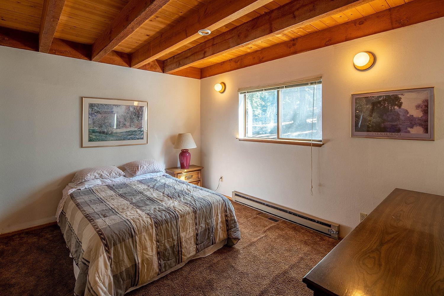 12119 Brookstone Drive Truckee, CA 96161 - Photo 12 of 21 a bedroom with a bed and wooden floor