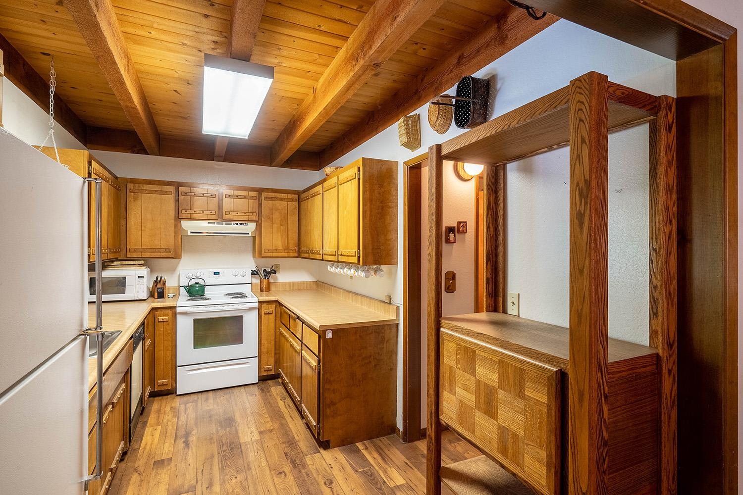 12119 Brookstone Drive Truckee, CA 96161 - Photo 10 of 21 a kitchen with cabinets and wooden floor