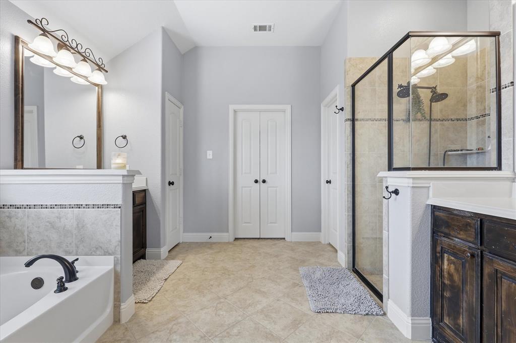 1105 Safrano Street Midlothian, TX 76065 - Photo 14 of 25 a view of a bathroom with tub and mirror