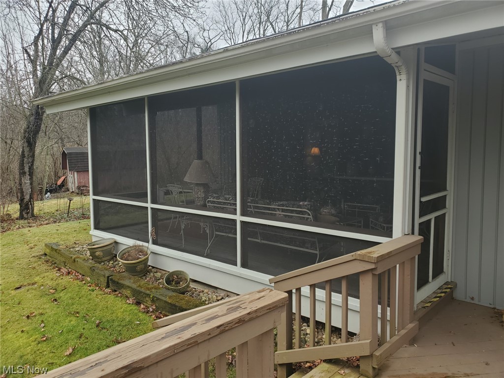 460 Aurora Hudson Road Aurora, OH 44202 - Photo 43 of 44 REAR VIEW OF SCREENED PORCH.