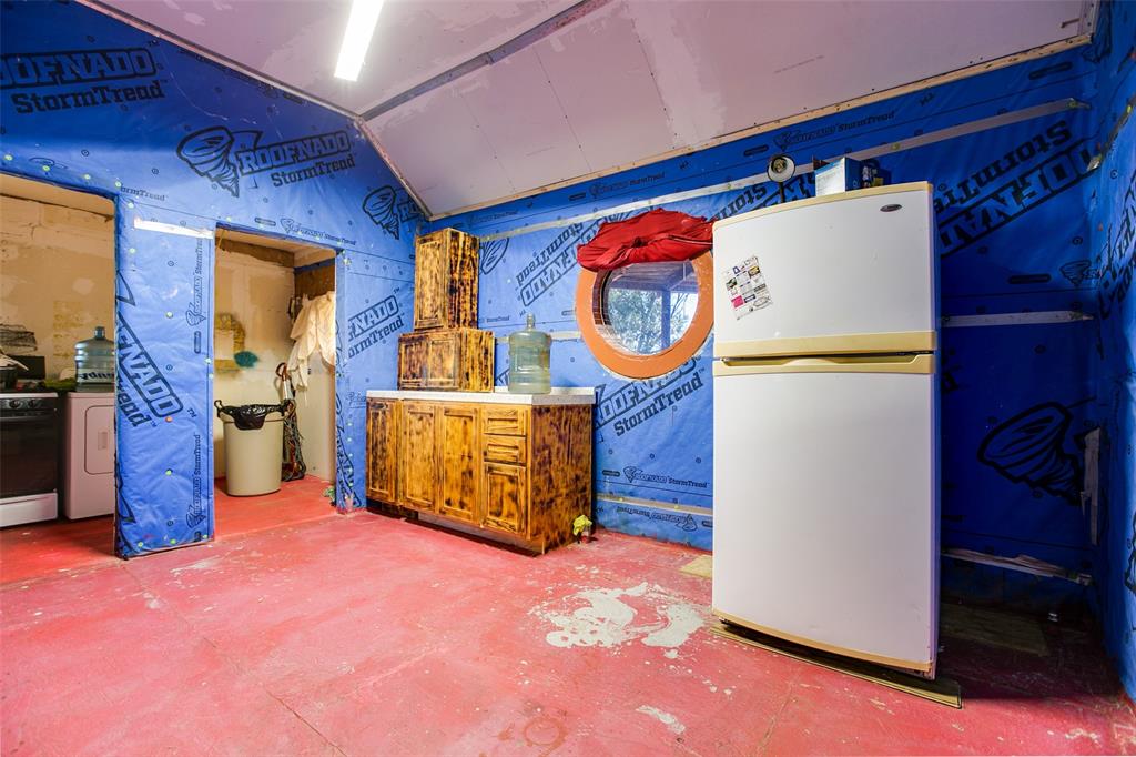 1303 North 7th Street Ballinger, TX 76821 - Photo 17 of 26 a view of a storage & utility room with washer and dryer