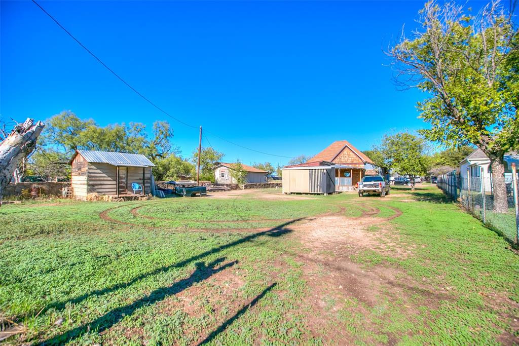 1303 North 7th Street Ballinger, TX 76821 - Photo 26 of 26 a view of house with garden
