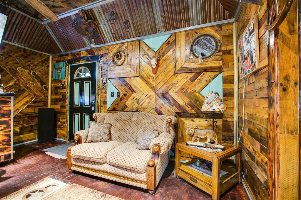 1303 North 7th Street Ballinger, TX 76821 - Photo 8 of 26 a living room with a couch and a stove